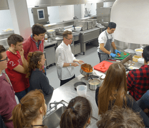 Students having a cooking lesson with Dyson's Head Chef